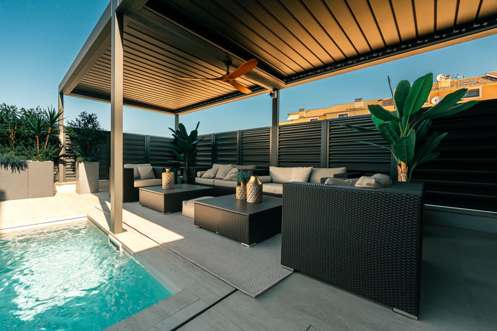 Velora's covered pergola lounge terrace at dusk