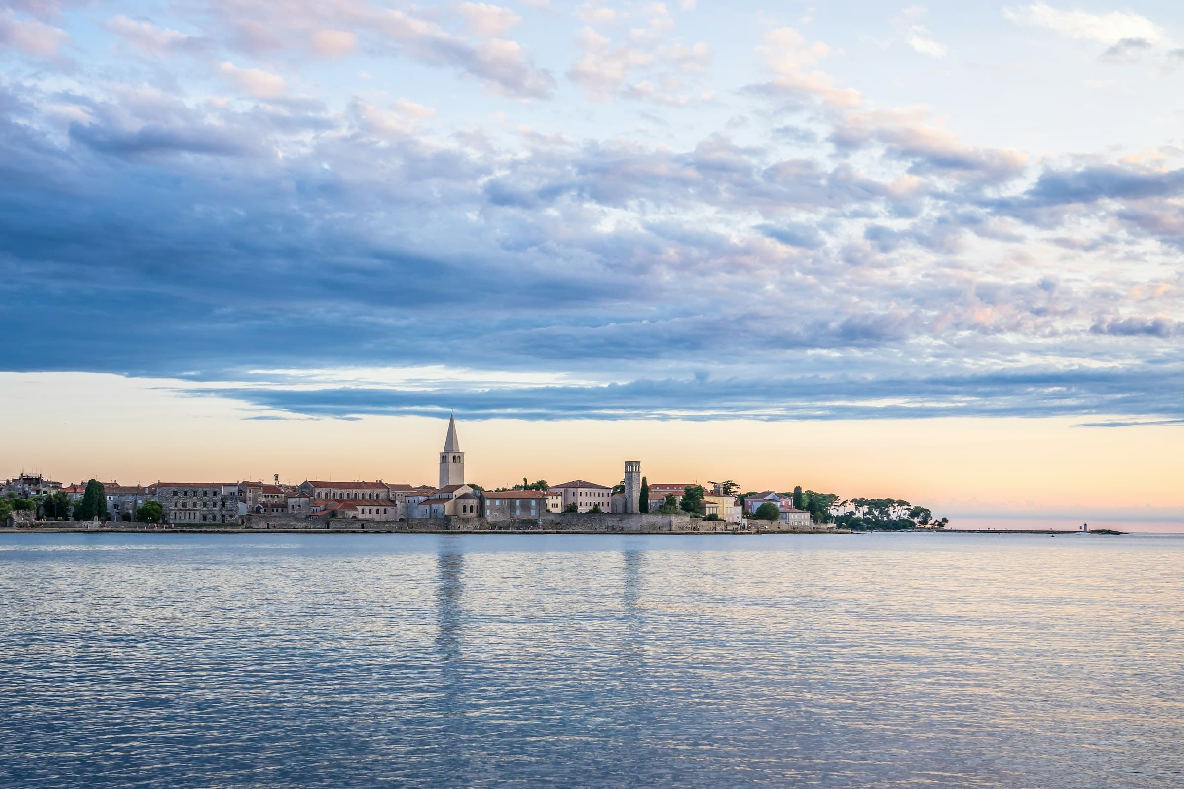 Sunset view of Poreč's waterfront and bell tower